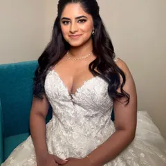 The full look is one of modern elegance. The simple yet flawless makeup pairs perfectly with her beautiful lace wedding dress.
