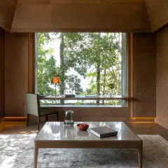 The private study area in our Junior Suite overlooks the lush green landscape. It is a quiet corner to read or reflect, with abundant natural light.