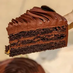 The layers of our Belgian Dark Chocolate cake speak for themselves. Rich, velvety ganache is sandwiched between our signature moist chocolate sponge for a pure chocolate experience.