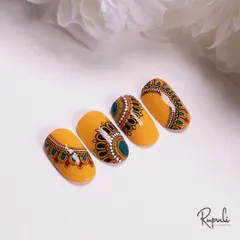 This yellow mandala design is perfect for Janmashtami or any celebration. The intricate patterns are all hand-painted with care.