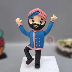 A close-up of the dancing Chef Harpal Singh Sokhi figurine. Capturing his energy and signature style was so much fun.