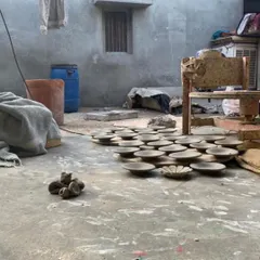 The workshop of Ramzu Bhai, where clay is transformed into art. These half-fired white terracotta tiles, drying in the courtyard, are part of a collaborative process that connects my designs directly with the rich craft traditions of India.