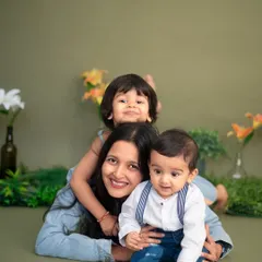A mother piled under her two adorable boys during our Mother's Day mini-sessions. This playful photo perfectly captures the fun and love of motherhood.