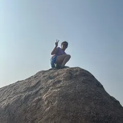 A victory sign from the top of a boulder. Each climb, big or small, is a personal victory and a lesson in what we are capable of.