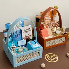Our Rattan Collection for Diwali. These elegant woven baskets come in beautiful pastel blue and tan, filled with gourmet snacks and festive decor.