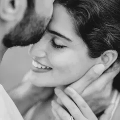 An intimate black and white close-up of Dylan and Maclene. This portrait focuses purely on the couple's emotion and connection, highlighting the engagement ring as a subtle detail.