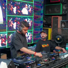 A back to back set in progress, with live VDJ visuals playing on the screen. I often team up with other DJs to deliver a dynamic and varied musical journey.