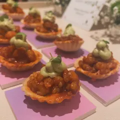 Prawn Balchao Tartlets served at the Rahul Mishra flagship store launch in Mumbai. These bites offered a bold, coastal flavor, providing a delicious contrast to the delicate couture on display.