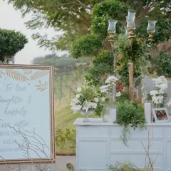 The welcome setup for the evening, where a beautifully framed sign and elegant floral arrangements greeted guests, setting the tone for a night of love and laughter.