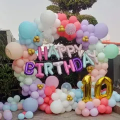 A beautiful outdoor balloon ring for a 10th birthday celebration at home. The pastel colors look wonderful in natural daylight.