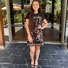 This dress is a masterclass in using detail to flatter your shape. The vibrant thread embroidery on a black base creates a beautiful silhouette and cinches at the waist, enhancing the body's natural curves without any extra effort.