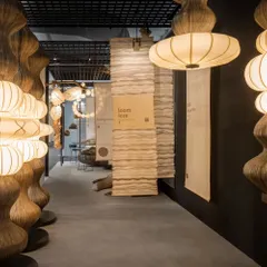 This was the entrance to the Oorjaa booth we designed at India Design. We used simple, hanging kora fabric panels to create pathways and demarcate different zones. The design guides visitors through the space, allowing the sculptural lighting to be the main focus while creating an intuitive and calming experience.