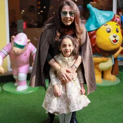 Posing with our friendly statues. We have fun photo opportunities for the whole family all around the play area.