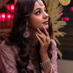 A classic beauty portrait with a focus on the model's profile and the intricate jewellery. The soft lighting and thoughtful pose create an elegant and timeless image for any portfolio.