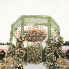 Inspired by French garden gazebos, we designed this soft green lattice mandap for an elegant outdoor wedding. It was built to feel as if it had always been part of the landscape, blending structure with nature.