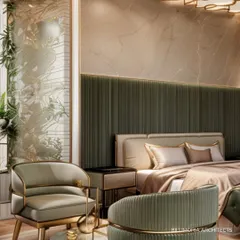 A close-up of the seating area within a master suite, featuring a custom-designed armchair with gold trim. The fluted green headboard and nature-inspired wall art add layers of texture and color to this elegant space.