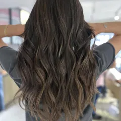 This is a great example of a cool-tone balayage transformation. The result is a sophisticated and modern look, perfect for getting your hair summer-ready.