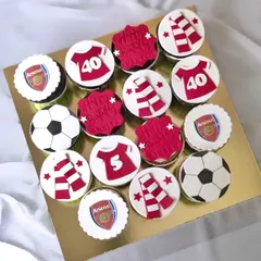 Customized cupcakes are a fun and personal way to treat the team. This set was made for a group of Arsenal fans, with each cupcake featuring a different element like the team logo, a jersey, or a football.