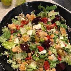 This summer salad is loaded with nutrition. It combines lettuce, spinach, paneer, chickpeas, and quinoa with a simple dressing of olive oil and lemon juice. A delightful way to get your nutrients in one bowl.