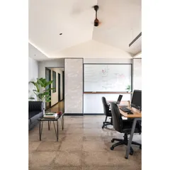 We discovered a hidden gabled roof during this office renovation and decided to make it the centerpiece. The vaulted ceiling transforms a standard workstation area into an open, airy environment. This space shows my belief in adaptive design and finding beauty in unexpected structural elements.