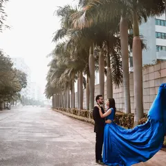 A cinematic shot where the city street becomes your stage. The flowing trail of the gown adds a touch of drama and movement, turning a simple embrace into a grand, romantic statement.