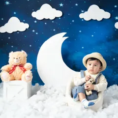 A dreamy half-birthday shoot with a moon and stars theme. This handsome little boy looks so sweet sitting among the fluffy clouds.