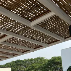 Another look at the woven bamboo ceiling. The natural material and intricate pattern create a stunning visual effect, especially with the modern black light fixtures we installed.