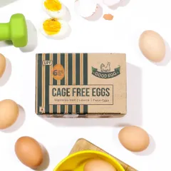 A fitness-themed flat lay for cage-free eggs, styled with a dumbbell and a cutting board on a clean white background to appeal to health-conscious consumers.