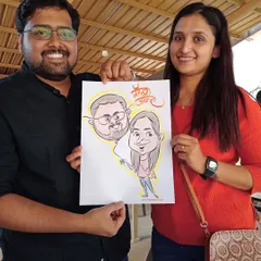 A fun, themed caricature for a couple, complete with their names in beautiful Marathi calligraphy. These personalized touches make the artwork even more special.