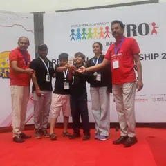 Another team proudly displays their bronze medal from the WRO elementary category. We focus on building strong teamwork and problem-solving skills, which are essential for success in competitive robotics.