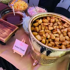 Our Indori Chaat counter is a crowd favorite at corporate events. This setup features crispy fried potatoes ready to be mixed with an assortment of chutneys, onions, and sev for a tangy and savory snack.