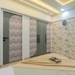 I designed the wardrobe and door to match, using a combination of sage green and a chevron-patterned laminate. This thematic approach ensures that every element in the room feels connected and thoughtfully planned.