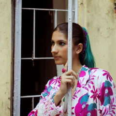 A close-up portrait from the print-on-print look. My styling is about creating a complete character, from the outfit and accessories right down to the hair and makeup.