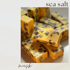 A custom Sea Salt and Musk soap with distinctive dark chunks. This bar is a great example of how we can create unique textures and designs for a truly one-of-a-kind product.
