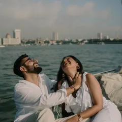 Pure, uninhibited laughter on a yacht against the Mumbai skyline. These are the moments that truly define a relationship.