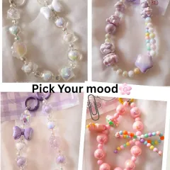 Pick your mood from this collection of kawaii bag charms. Whether you love the iridescent white bow charm, the purple teddy and star charm, or the bright pink candy bead charm, there's a style for every vibe.