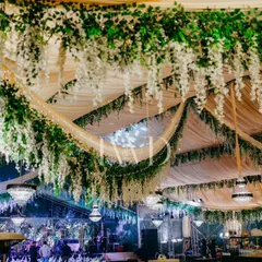 Another view of the spectacular floral ceiling, showing the scale of the installation. We aim to create immersive environments that transport your guests.