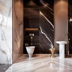 This powder room makes a bold statement with floor-to-ceiling dark marble. A minimalist pedestal sink and gold accents provide a striking contrast, creating a space that is both dramatic and elegant.