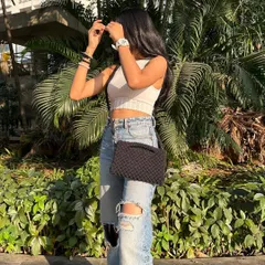 The same bag worn as a cross-body sling. This style is perfect for shopping or exploring, keeping your hands free while your belongings stay secure.