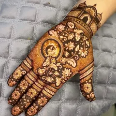 A beautiful single hand design for Karwa Chauth, featuring a peacock within a circular frame and an architectural cuff.