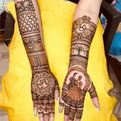 A design featuring the initial 'A' in a mandala on one hand and a couple portrait on the other.