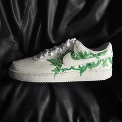 A side profile of the white floral custom sneaker.