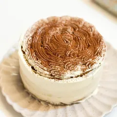 Lost in a world of gluten-free Tiramisu bliss. This cake is made with almond flour and is a coffee lover's dream, without any gluten.