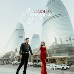 A powerful, modern pre-wedding portrait in Baku, Azerbaijan. The striking architecture of the Flame Towers provides a futuristic backdrop, while the couple's confident stride makes for a stylish, editorial-quality photograph.