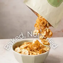 Baked, not fried. My Masala Banana Chips are seen pouring into a bowl, highlighting their light and crispy texture. This is healthy snacking made easy and delicious.