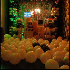 A view from the floor, looking up at the kitty party decoration. The mass of balloons on the floor makes the space feel full and festive, inviting guests to dive into the fun.