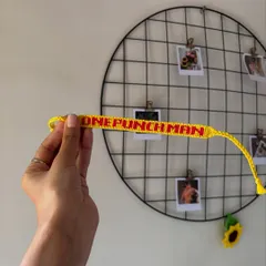 A custom bracelet for a One-Punch Man fan. This alpha pattern bracelet spells out "ONE PUNCH MAN" in Saitama's signature red and yellow colors.