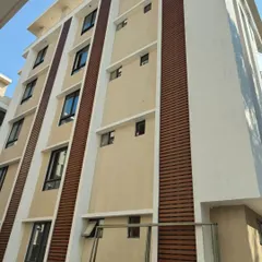 Here, our wood-finish metal louvers add warmth and texture to this building's elevation. It's a perfect example of how we use cladding to break the monotony of a plain wall and add character.