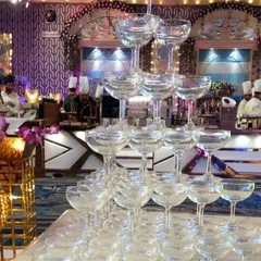 A champagne tower adds a touch of celebration and spectacle to any event. It's a classic feature for company milestones, holiday parties, or to celebrate the success of a product launch, creating a memorable photo moment.