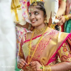 The bride's joyful upward glance as the sacred knot is tied. This is a pinnacle moment of a Telugu wedding, and we capture the pure emotion and significance of the tradition.